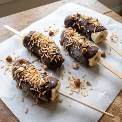 Frozen Dark Chocolate Dipped Banana Pops with Toasted Coconut and Crushed Almonds